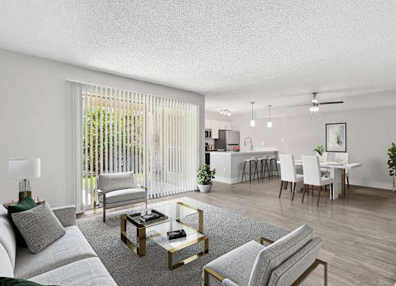 our apartments offer a living room with a couch a coffee table and a dining table