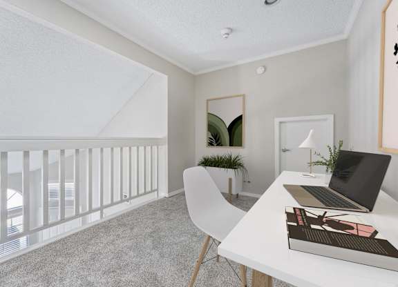 a home office with a white desk and a laptop on a desk