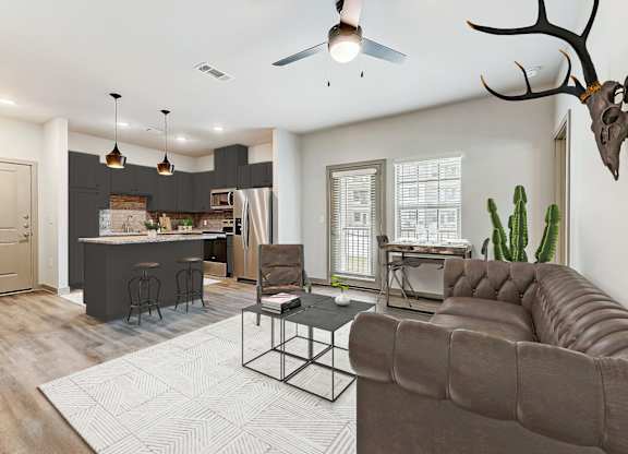 a living room and kitchen with a couch and a table