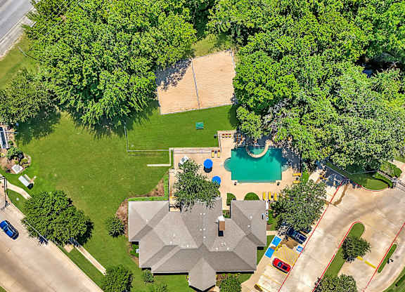 A house with a pool and a playground in the backyard.