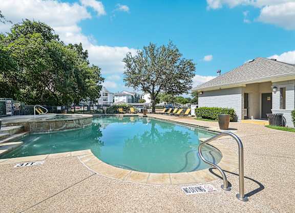 the preserve at ballantyne commons pool and spa with building and trees