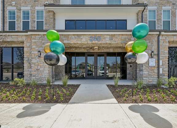 a building with balloons in front of it