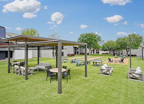 a rendering of a picnic area with tables and chairs on the grass