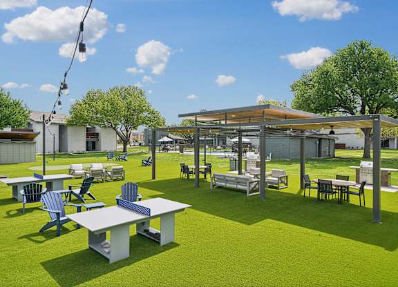 a rendering of a park with tables and chairs and a pavilion