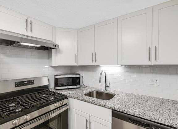 Renovated Kitchen with Granite Countertops & Stainless Steel Appliances