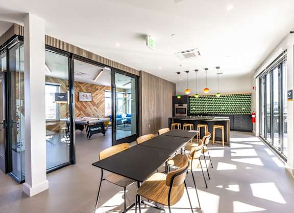 A conference room with a long table and chairs.