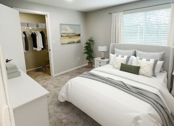 a bedroom with a large window and white furniture at The Meadows, Massachusetts