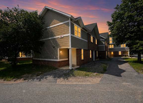 A building with a driveway in front of it.