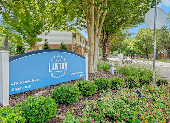 A blue sign with white text that says "The Lawton" on it.