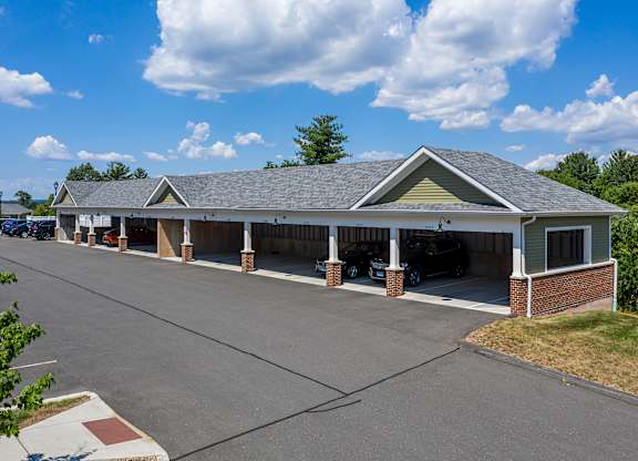 A building with a parking lot in front of it.