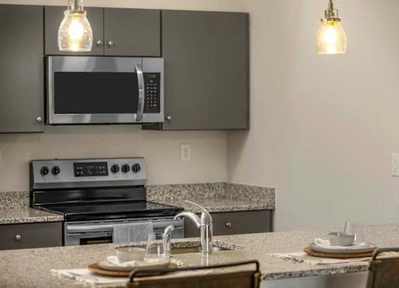 a kitchen with a sink and a microwave