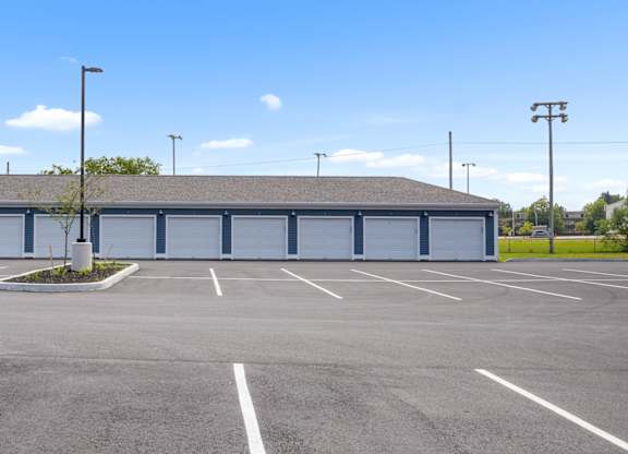 A large building with a parking lot in front of it.