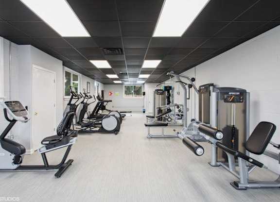 a room filled with lots of different types of exercise equipment at The Lawton Townhomes, Chesterfield