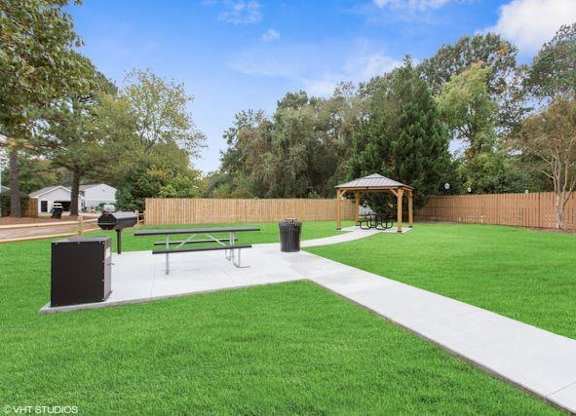 a park with a picnic table and a grill at The Lawton Townhomes, Virginia
