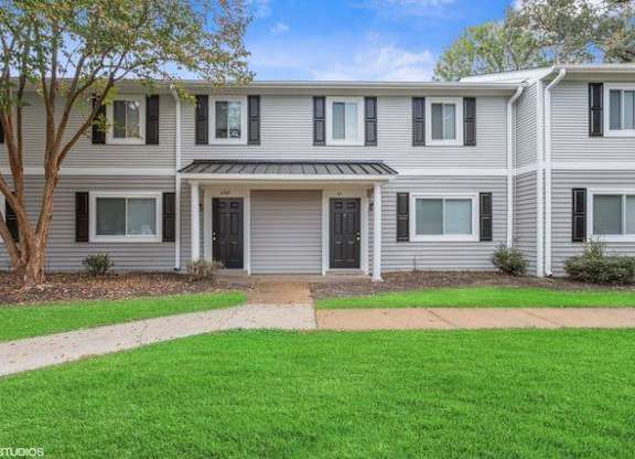 a house with a green lawn and a tree at The Lawton Townhomes, Chesterfield , VA 23832