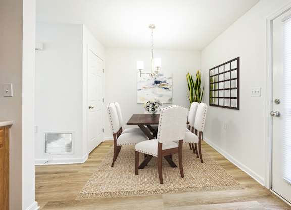 A dining room with a table and chairs at Windsor Terrace, Hooksett, NH