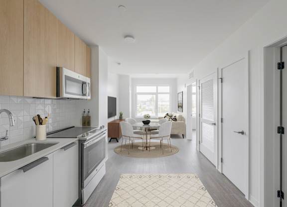 A modern kitchen with a dining table set for four.