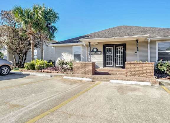 A house with a driveway in front of it.