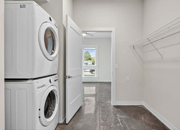 A laundry room with a washer and dryer in it.