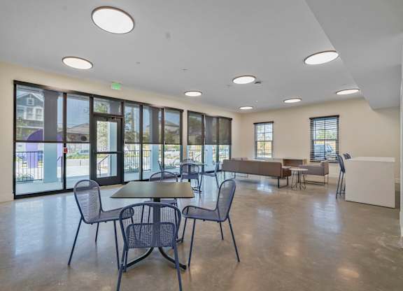 A room with a table and chairs in it.