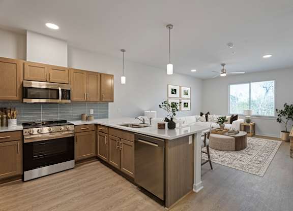 A modern kitchen with wooden cabinets and a large island.