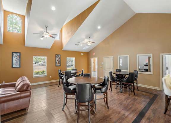A room with a table and chairs in it.