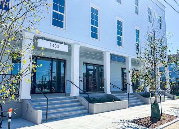 A white building with the number 1433 on the front.