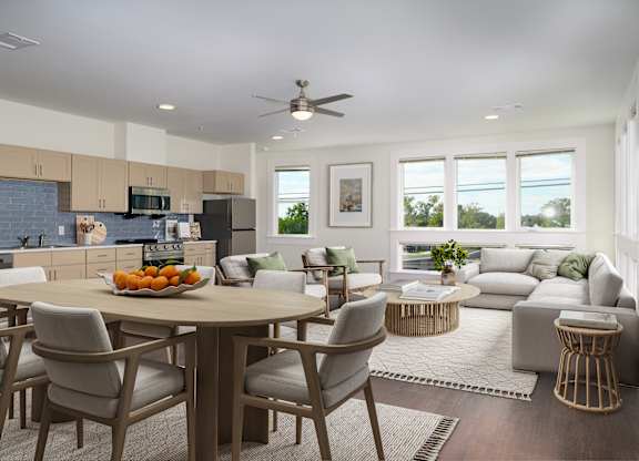 A modern dining room with a wooden table and chairs.