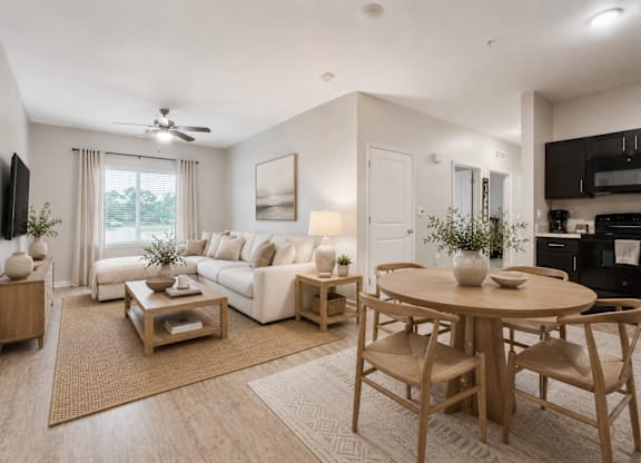 A well-lit, modern living room with a dining area.