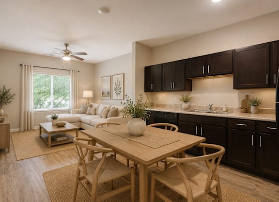 A modern kitchen with a dining table and chairs.