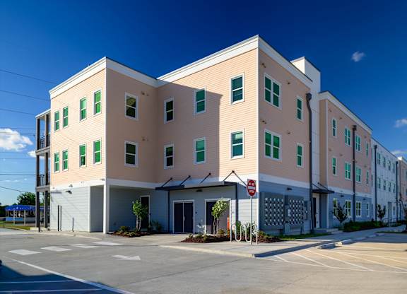 A large building with a stop sign in front of it.