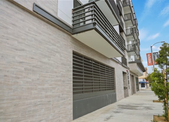 a garage door on the side of an apartment building at The Fairfax Flats Apartments, Los Angeles, CA