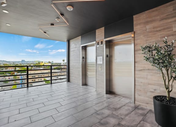 a view of the front doors of a building at The Fairfax Flats Apartments, California