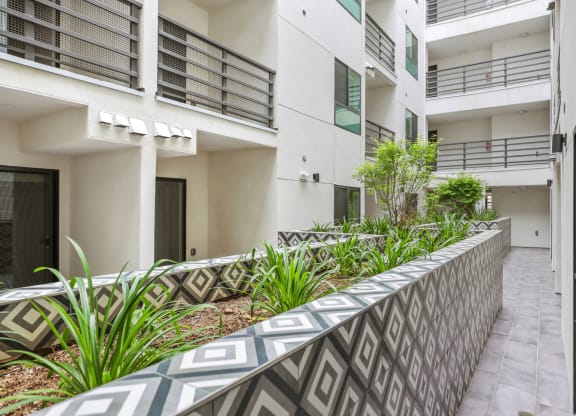 a view of the apartment building from the outside at The Fairfax Flats Apartments, California, 90019