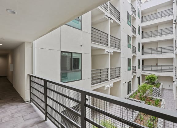 a view of the balconies of an apartment building at The Fairfax Flats Apartments, Los Angeles, CA, 90019