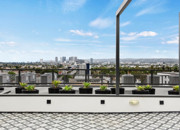a view of los angeles from a roof top terrace at The Fairfax Flats Apartments, California