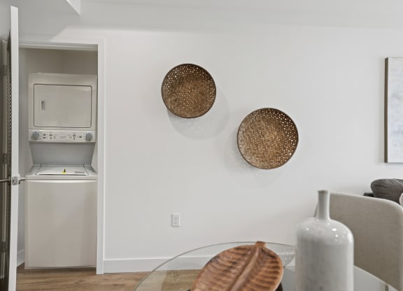 a living area with a glass coffee table and a gray couch at The Fairfax Flats Apartments, Los Angeles, CA, 90019