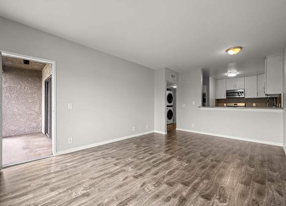 A room with a wooden floor and a speaker in it at Lafayette Apartments, Los Angeles 90019