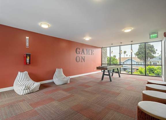 A room with a red wall and a sign at Lafayette Apartments, Los Angeles 90019