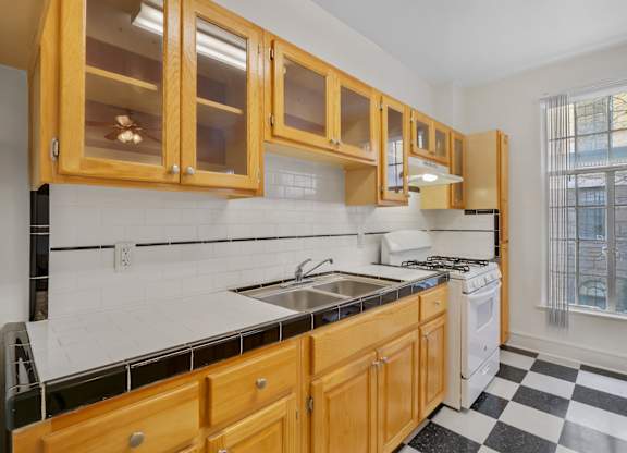 Kitchen with sink at The Langham Apartments, Los Angeles, CA