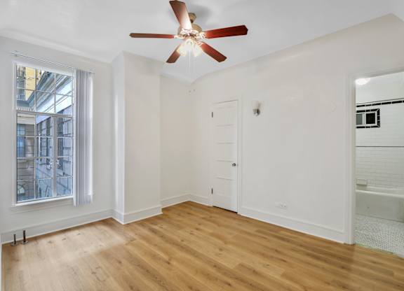 Unfurnished bedroom with window at The Langham Apartments, Los Angeles