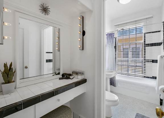 Bathroom with mirror at The Langham Apartments, California, 90005