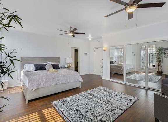 Living room with ceiling fan at The Langham Apartments, Los Angeles, CA, 90005