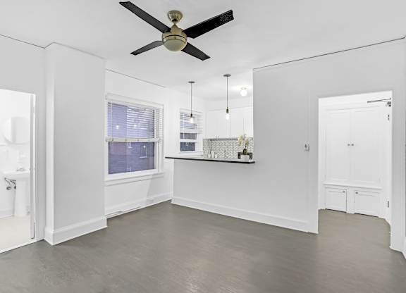 A spacious room with a ceiling fan and a window.at Park Wilshire, California, 90057
