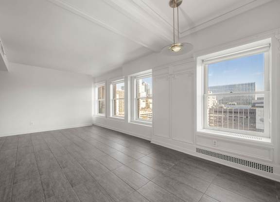 Room with Large windows at Grand Central Market Apartments, California, 90013