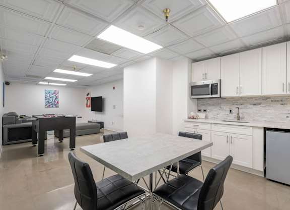 Kitchen with dining table at Grand Central Market Apartments, Los Angeles 