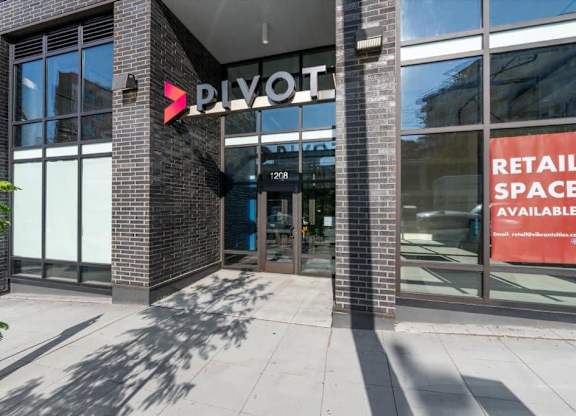The front of a building with a sign that says