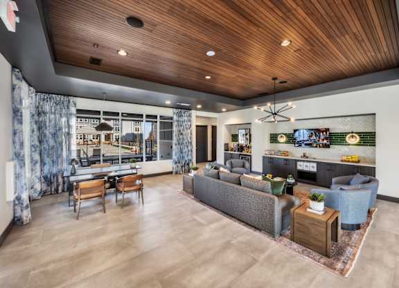 A modern living room with a grey sofa and wooden coffee table.