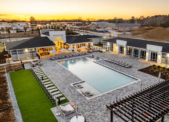 A large house with a pool in the backyard.