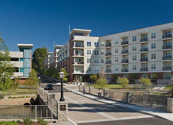 an apartment building on a city street with a bridge at Glenwood Park Lofts, Atlanta